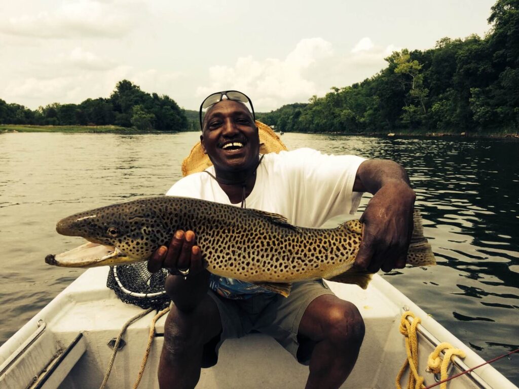 Happy Customer with Trophy Brown Trout